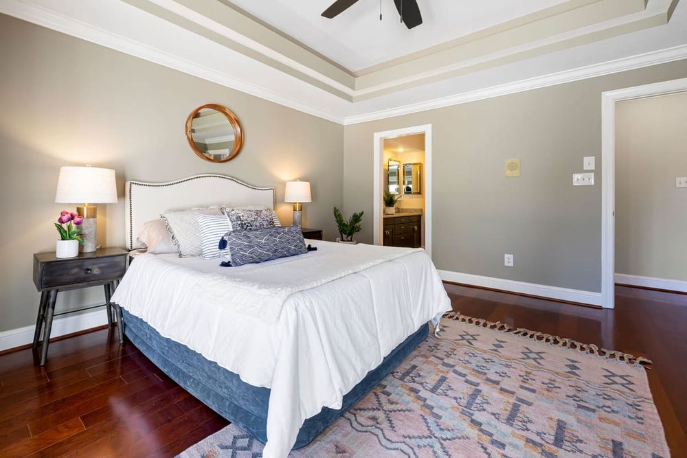 A stylish modern bedroom featuring elegant decor and lighting, perfect for interior design inspiration.