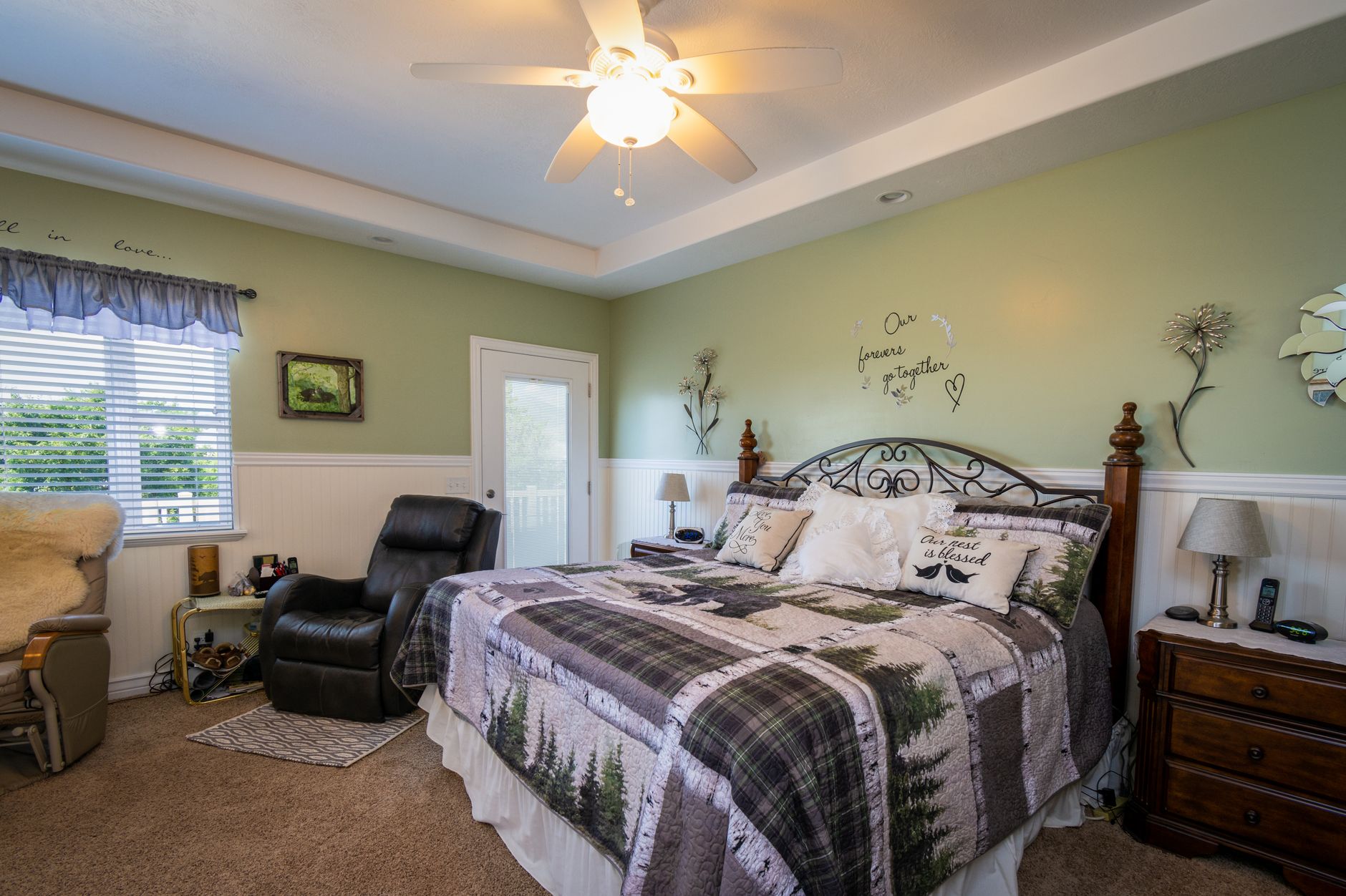 A spacious, well-lit bedroom with modern decor and comfortable bedding.