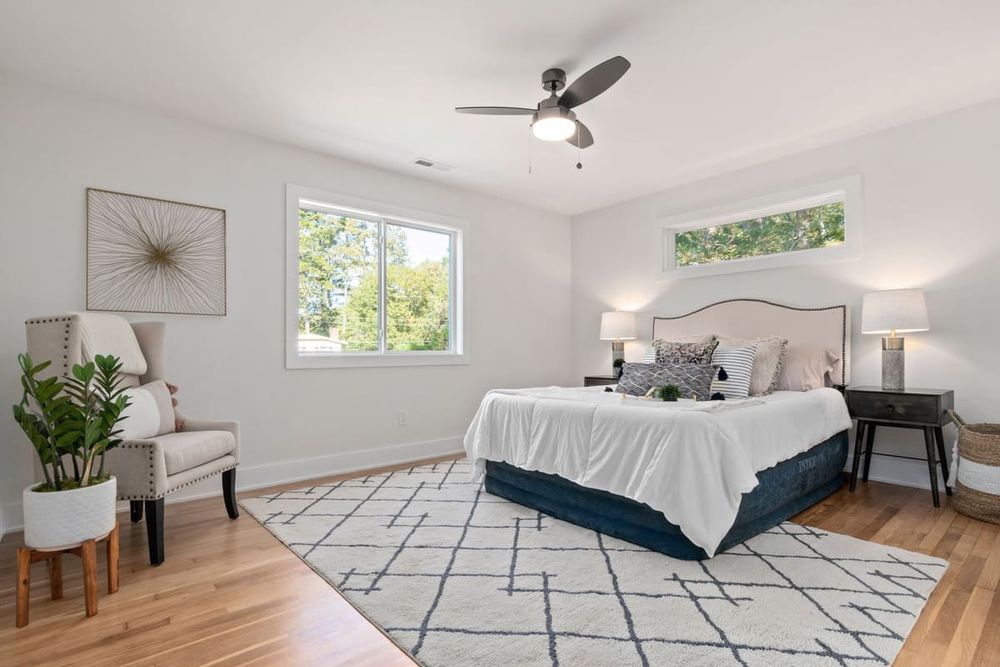 Bright and cozy bedroom interior featuring a stylish design with natural light.